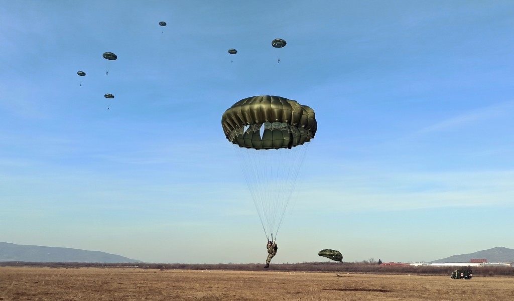 Soldiers doing military service perform first parachute jumps