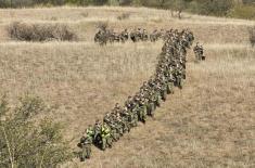 Cadets and students complete loaded march