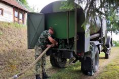 Members of SAF provide assistance to villagers in Prijepolje municipality