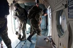 Soldiers doing military service perform first parachute jumps