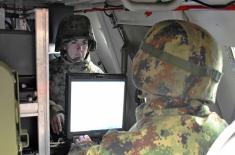 Crews using modern artillery systems conduct regular training