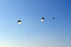 Soldiers doing military service perform first parachute jumps