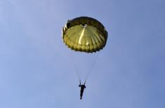 Soldiers doing military service perform first parachute jumps