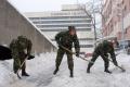 Cadets clearing snow in Clinical Center and Zemun hospital