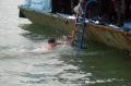 Swimming for the Holy Cross