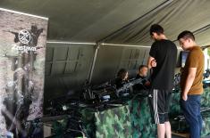 Numerous visitors at display of weapons and military equipment at Ušće