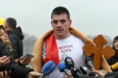 Members of the Serbian Armed Forces swimming for the Holy Epiphany Cross across Serbia