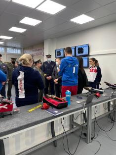 Minister Stefanović and Serbian national shooting team members with military school students  