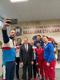 Minister Stefanović and Serbian national shooting team members with military school students  