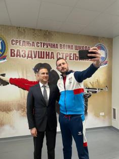 Minister Stefanović and Serbian national shooting team members with military school students  
