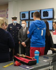 Minister Stefanović and Serbian national shooting team members with military school students  