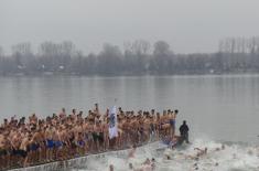 Members of the Serbian Armed Forces swimming for the Holy Epiphany Cross across Serbia