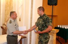 Presenting awards to soldiers who voluntary served their military service