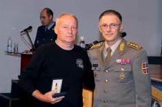 Military commemorative medals presented to members of the 250th AD Missile Brigade