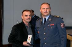 Military commemorative medals presented to members of the 250th AD Missile Brigade