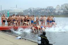 Members of the Serbian Armed Forces swimming for the Holy Epiphany Cross across Serbia