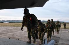 Members of the 63rd Parachute Brigade perform a night jump from 4,500 m