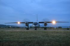 Members of the 63rd Parachute Brigade perform a night jump from 4,500 m