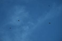 Members of the 63rd Parachute Brigade perform a night jump from 4,500 m