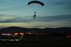 Members of the 63rd Parachute Brigade perform a night jump from 4,500 m