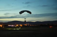 Members of the 63rd Parachute Brigade perform a night jump from 4,500 m