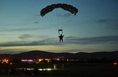 Members of the 63rd Parachute Brigade perform a night jump from 4,500 m