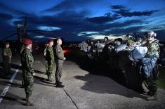 Members of the 63rd Parachute Brigade perform a night jump from 4,500 m