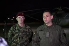 Members of the 63rd Parachute Brigade perform a night jump from 4,500 m