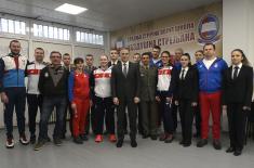 Minister Stefanović and Serbian national shooting team members with military school students  