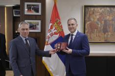 Ambassador Botsan–Kharchenko presents Rostec’s medal to Minister Stefanović