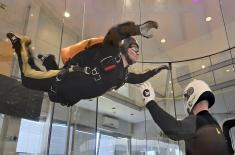 Military paratroopers undergo wind tunnel training