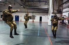 Military volunteers undergo basic parachute training
