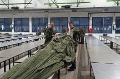 Military volunteers undergo basic parachute training