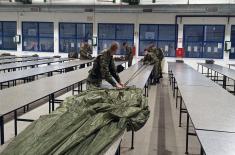 Military volunteers undergo basic parachute training