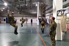 Military volunteers undergo basic parachute training