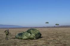 Soldiers performing military service make their first parachute jumps