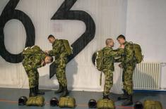 Soldiers performing military service make their first parachute jumps