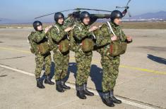 Soldiers performing military service make their first parachute jumps