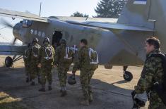 Soldiers performing military service make their first parachute jumps