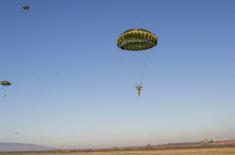 Soldiers performing military service make their first parachute jumps