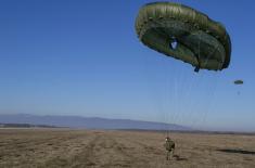 Soldiers performing military service make their first parachute jumps