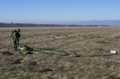 Soldiers performing military service make their first parachute jumps