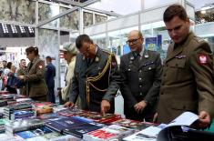 Military attachés visit the booth of the Ministry of Defence and the Serbian Armed Forces at the Book Fair